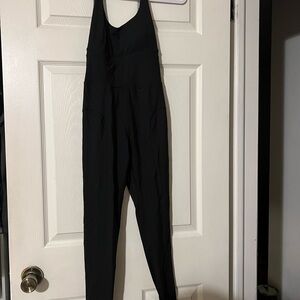 Black Halter Jumpsuit with Deep V-neckline and Form-fitting Design
